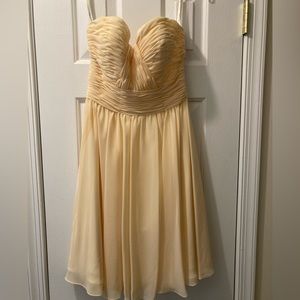 Pale yellow strapless dress in a size 6